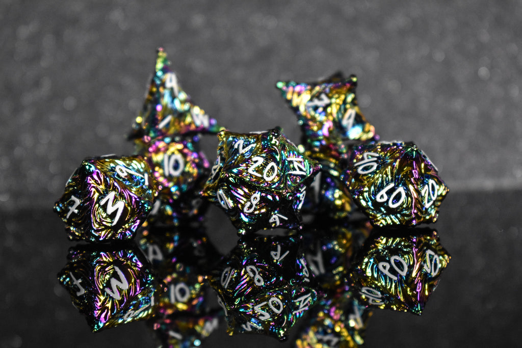 Iridescent metal dice with vortex swirls and a white font