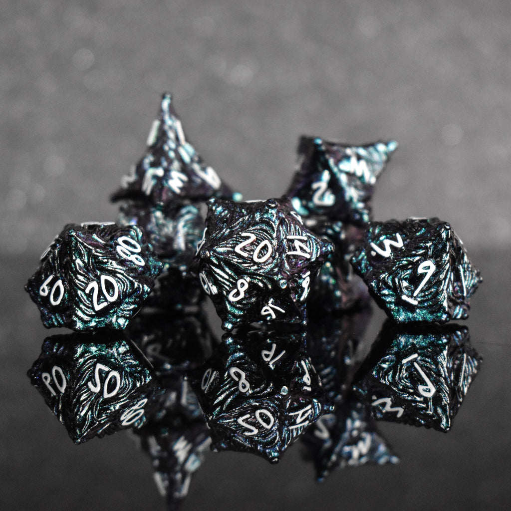 Iridescent galaxy vortex metal dice featuring white font numbers