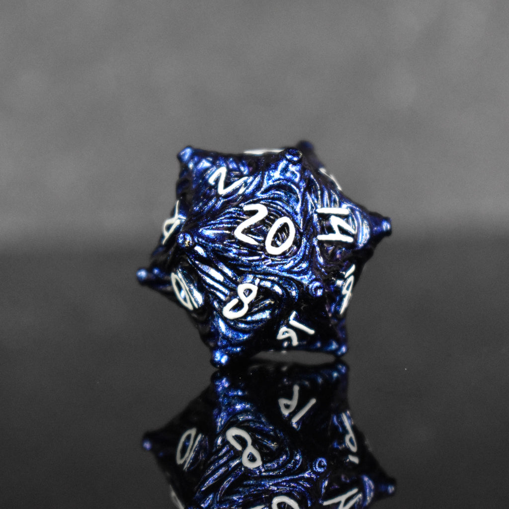 Dark blue metal D20 with vortex swirls and a white font