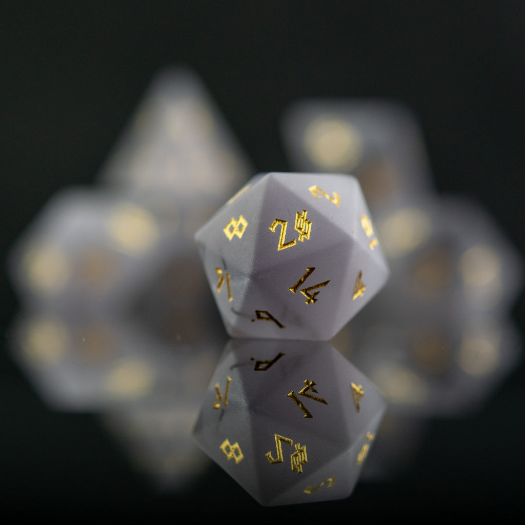 Frosted grey cat's eye stone dice set with golden nordic font