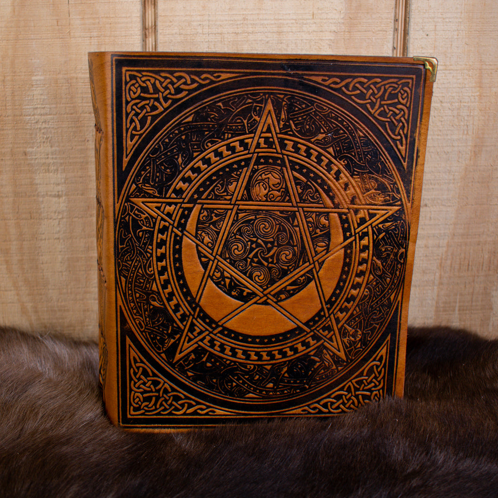 A large tan spell book leather journal featuring a pentacle