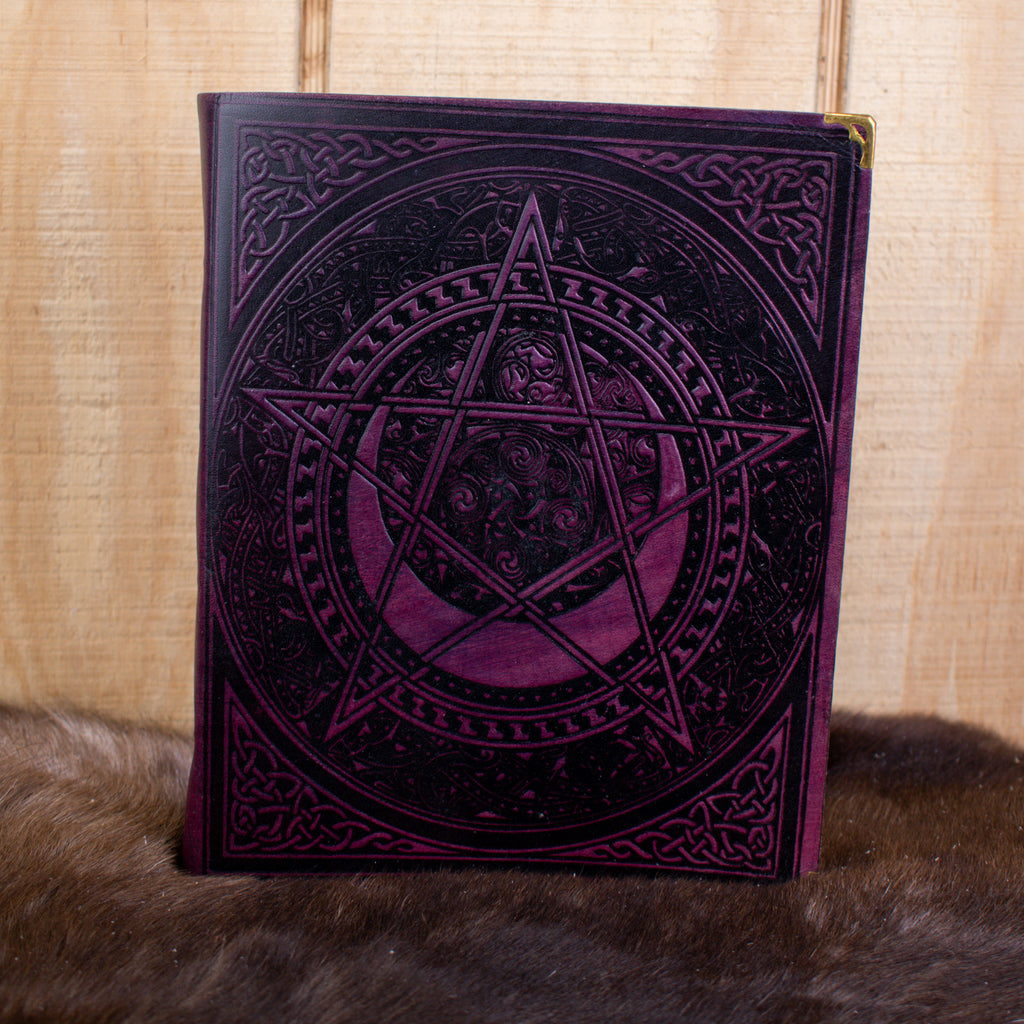 A large purple spell book leather journal featuring a pentacle