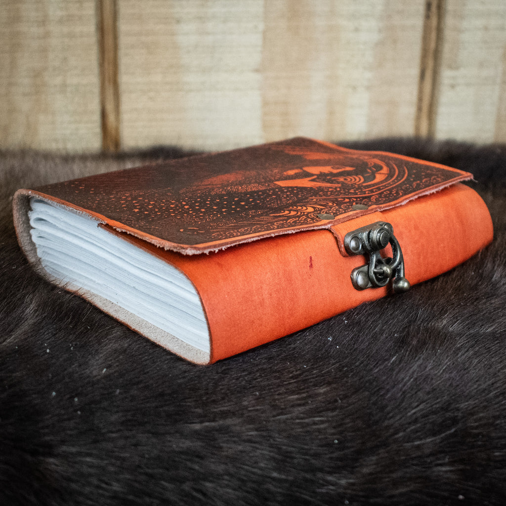An orange leather journal