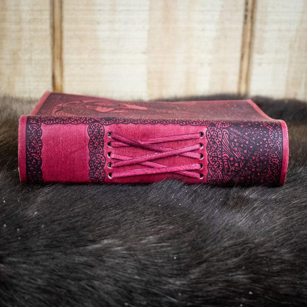 The spine of a read leather journal