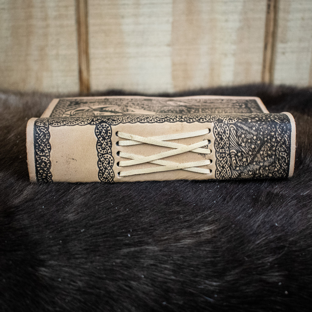 The spine of a cream leather journal