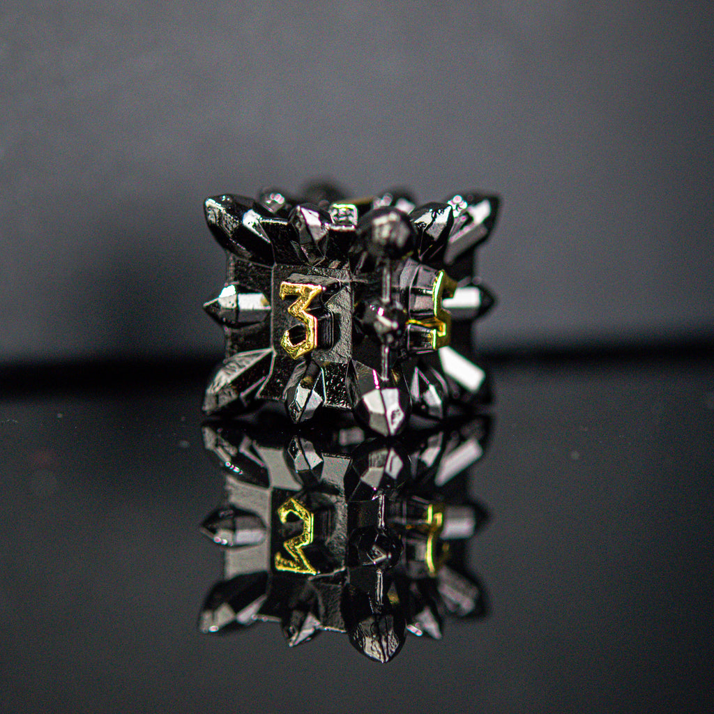 Spiky black metal D6 with gold numbers in a Nordic font