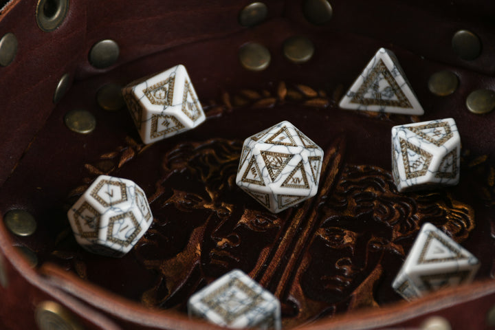 roman inspired white howlite dnd dice with intricate engravings