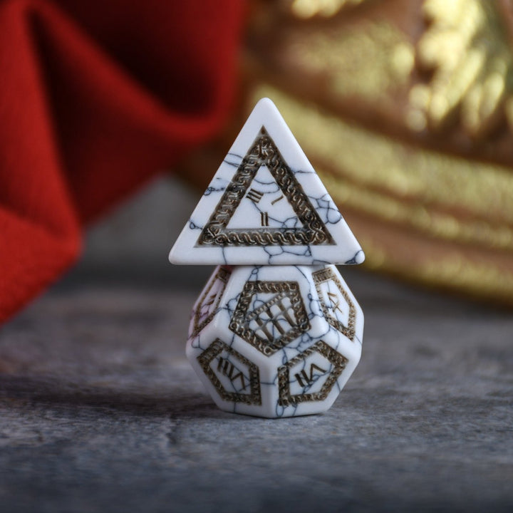 roman inspired white howlite dnd dice with intricate engravings