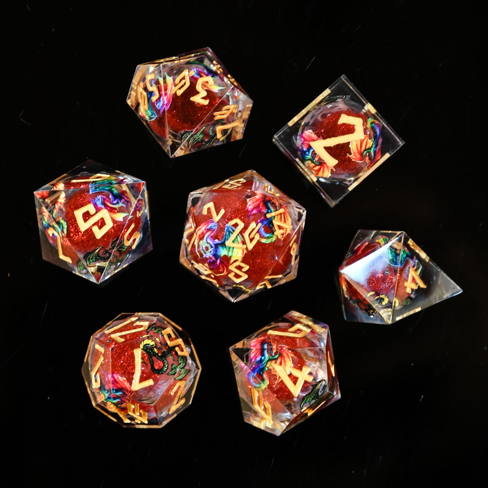 Set of colorful polyhedral dice with letter symbols on a black background