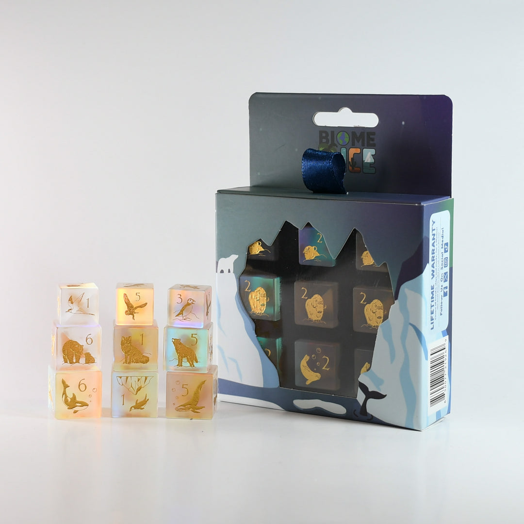 Set of transparent dice with animal illustrations and their corresponding numbers, displayed with packaging.
