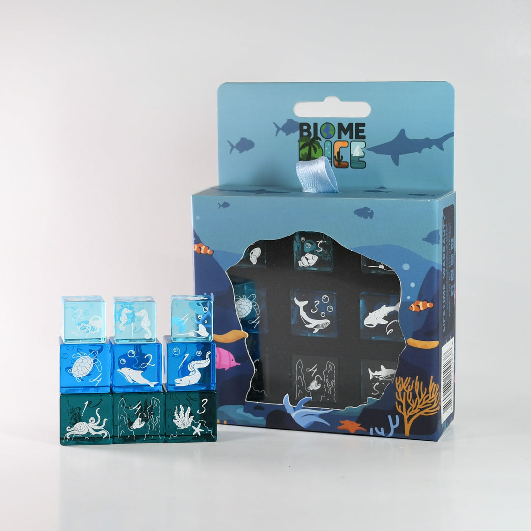Set of Biome Dice with packaging on a white background