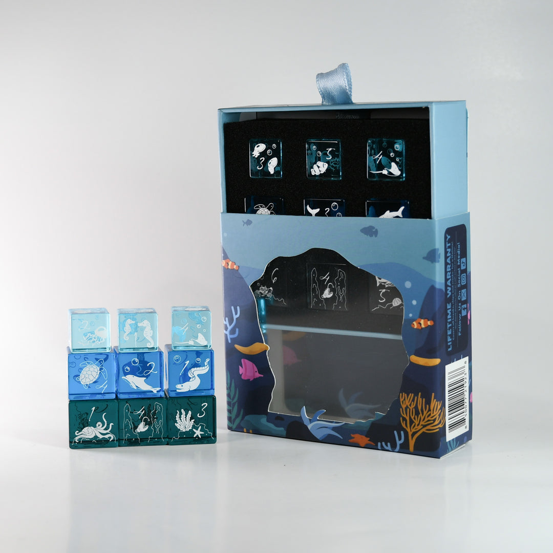 Set of decorative ice cube trays with packaging on a white background