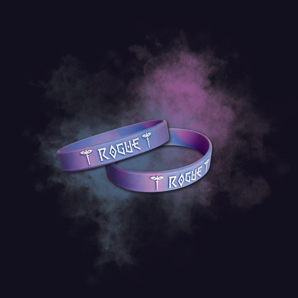 Two purple 'Rogue' wristbands on a dark background with purple smoke effect.