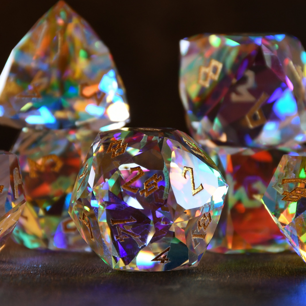 A close-up of a multifaceted, multicolored glass dice with engraved numbers, on a dark background.