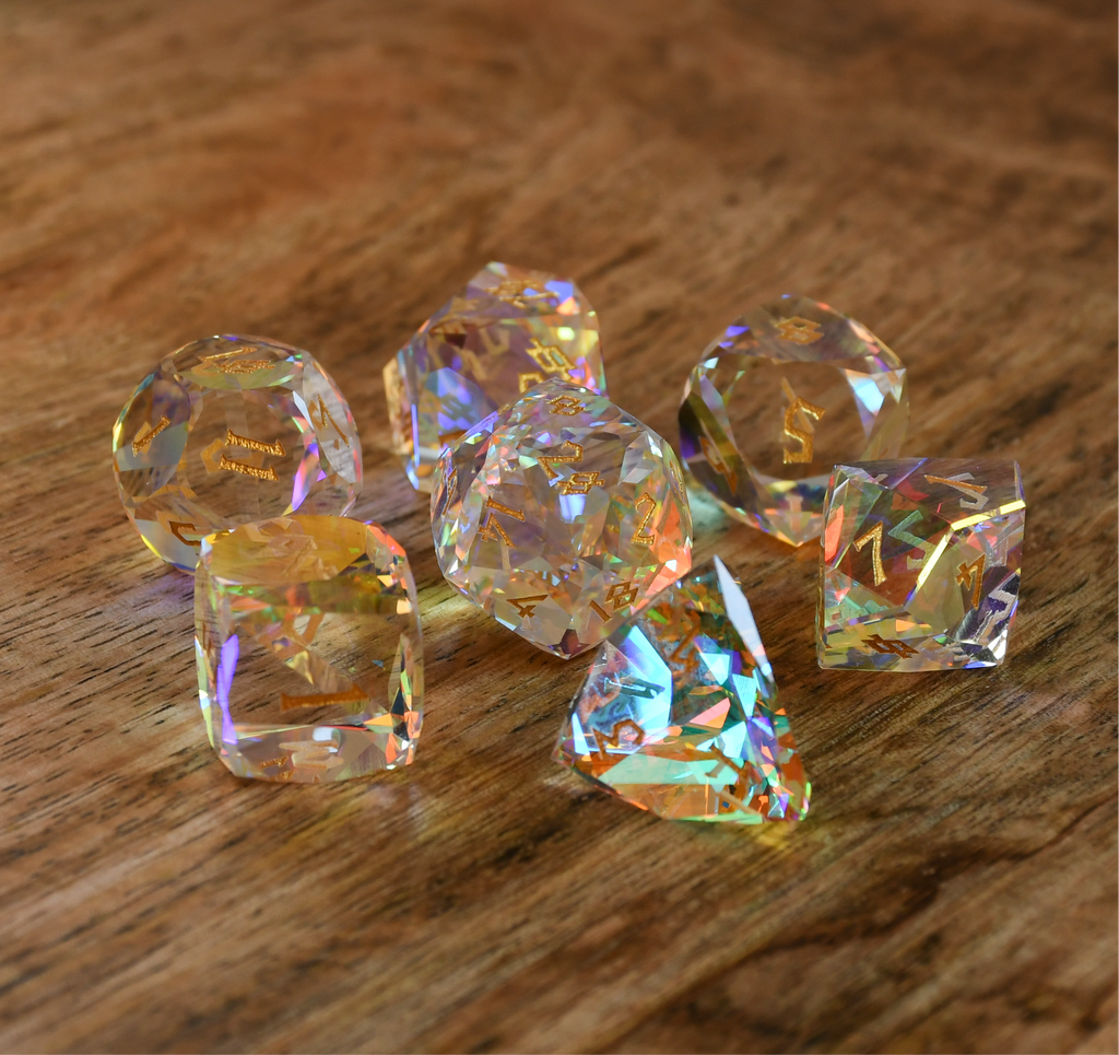 A close-up of a multifaceted, multicolored glass dice with engraved numbers, on a dark background.