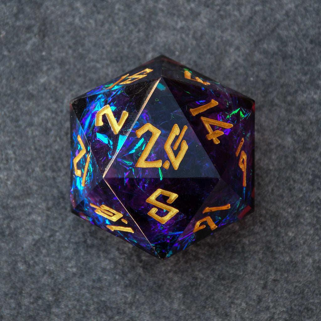 A hand-crafted, sharp-edged resin dice with hand-painted numbers, featuring a black color with purple and gold accents, illuminated by a spotlight.