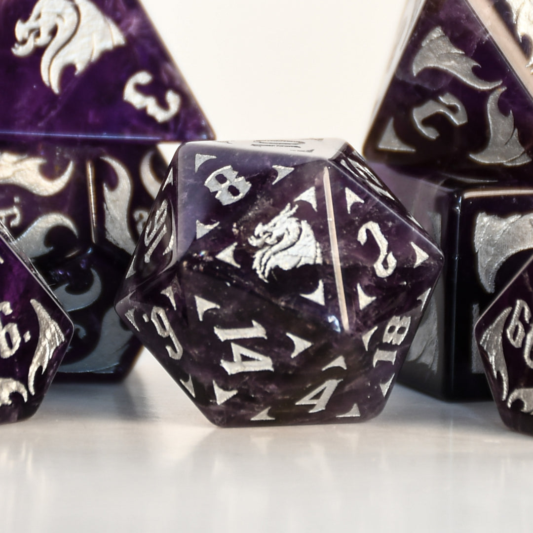 Dragon Amethyst Dice Set with silver numbering and symbols on a white background