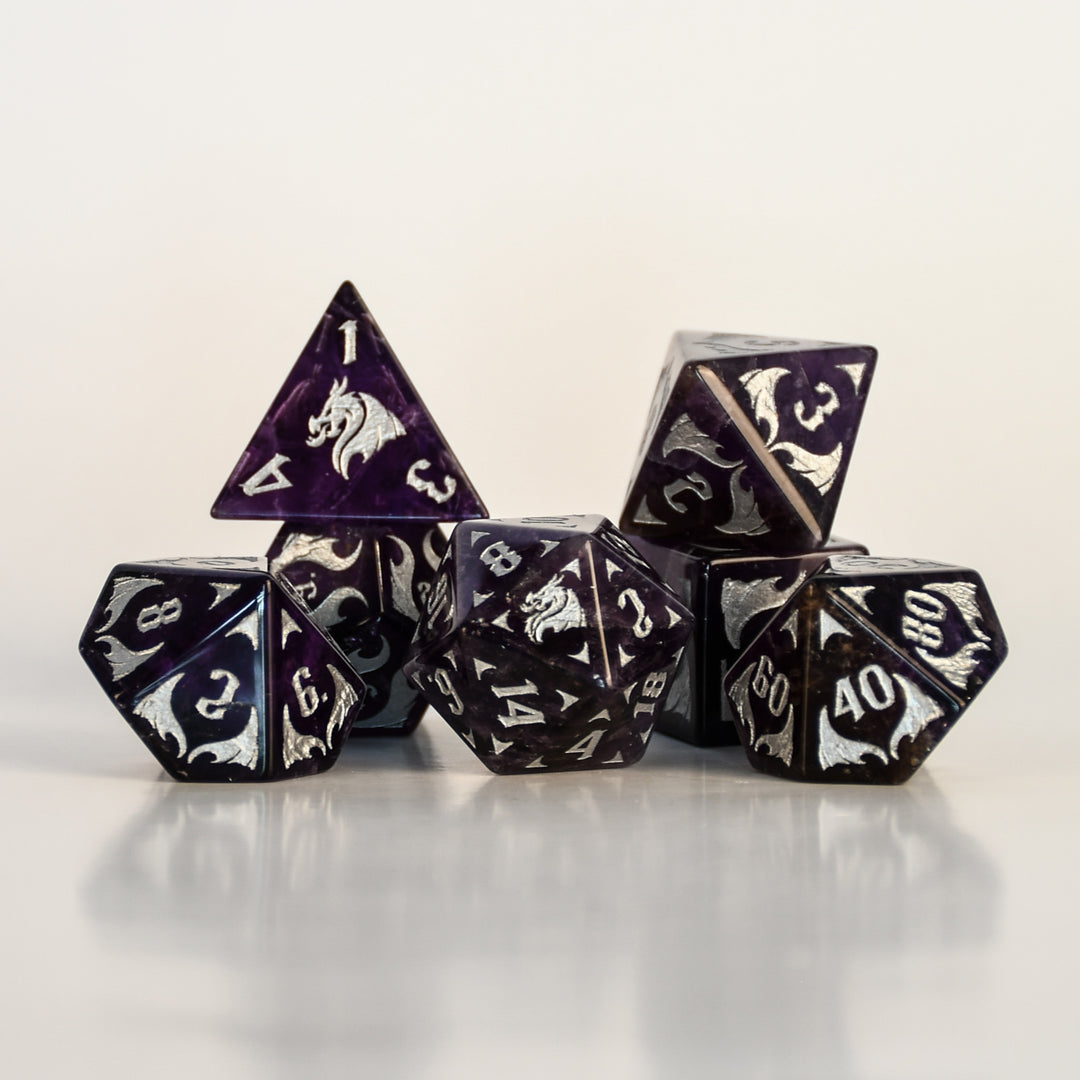 Dragon Amethyst Dice Set with silver numbering and symbols on a white background