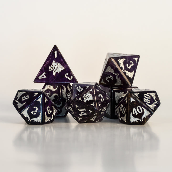 Dragon Amethyst Dice Set with silver numbering and symbols on a white background