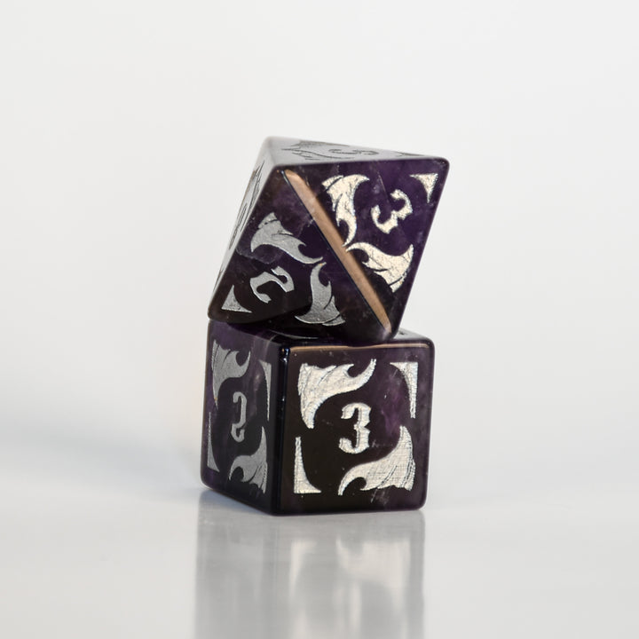 Dragon Amethyst Dice Set with silver numbering and symbols on a white background