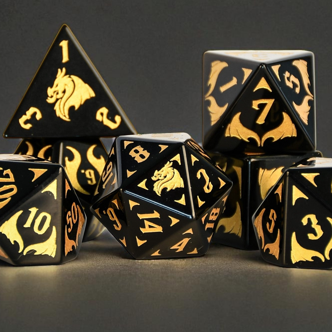 Black Obsidian Gemstone Polyhedral DnD Dice Set with gold numbers, dragon heads and wing adornments