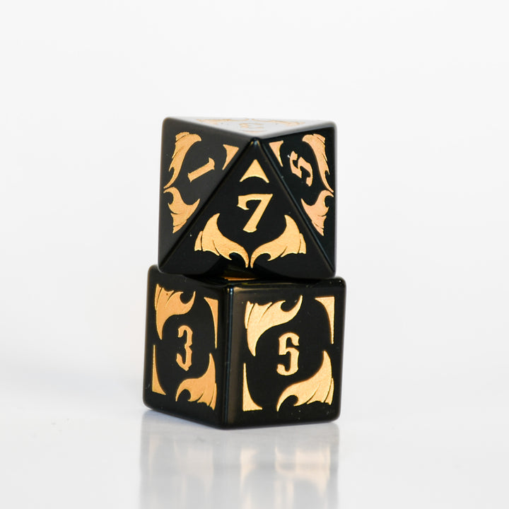 Black Obsidian Gemstone Polyhedral DnD Dice Set with gold numbers, dragon heads and wing adornments