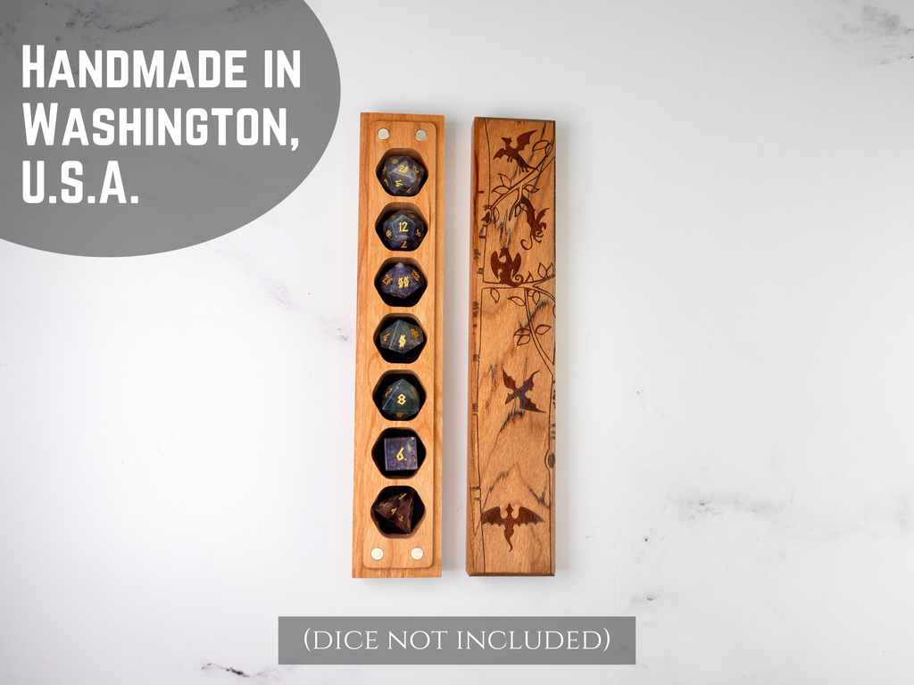 Wooden dice vault stands with engraved designs on a light gray background, labeled 'Handmade in Washington, U.S.A.'