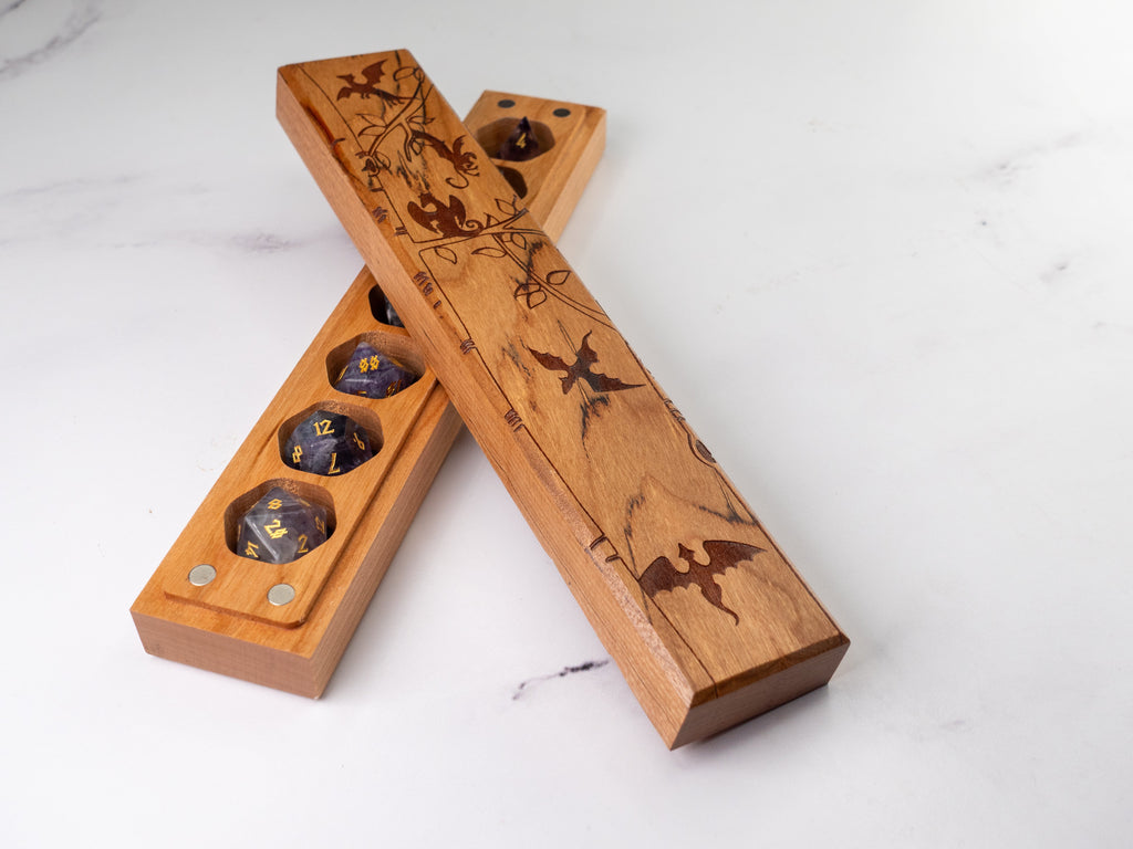 Wooden dice tray with compartments on a white surface