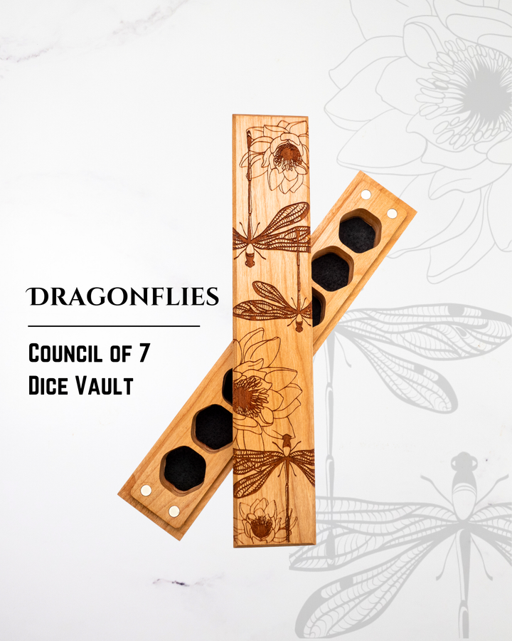 Wooden dice vault with dragonfly designs on a white background