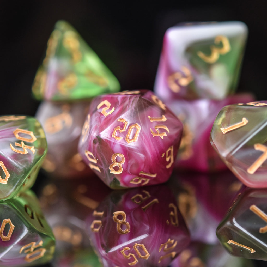 A set of multicolored acrylic dice with engraved numbers, including various shapes such as a d4, d6, d8, d10, d12, and d20, commonly used for RPGs.