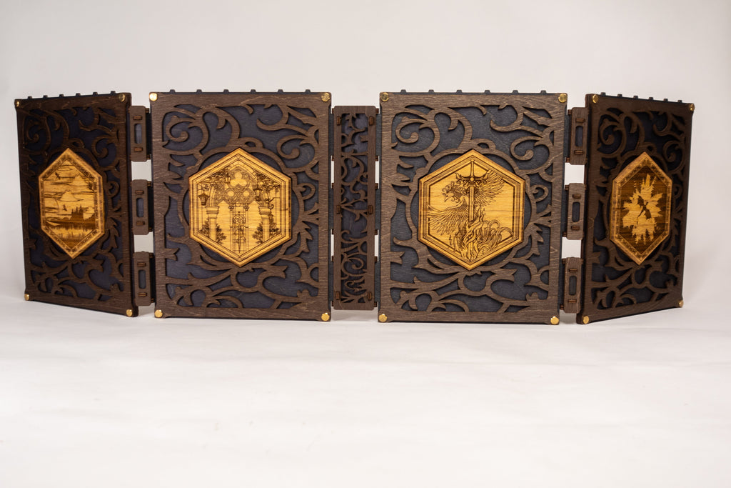 A selection of four compact dungeon master screens in various colors, each featuring a filigree pattern and brass fixtures, with magnetic acrylic panels for displaying maps and notes.