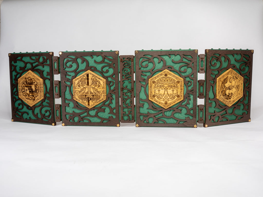 A selection of four compact dungeon master screens in various colors, each featuring a filigree pattern and brass fixtures, with magnetic acrylic panels for displaying maps and notes.