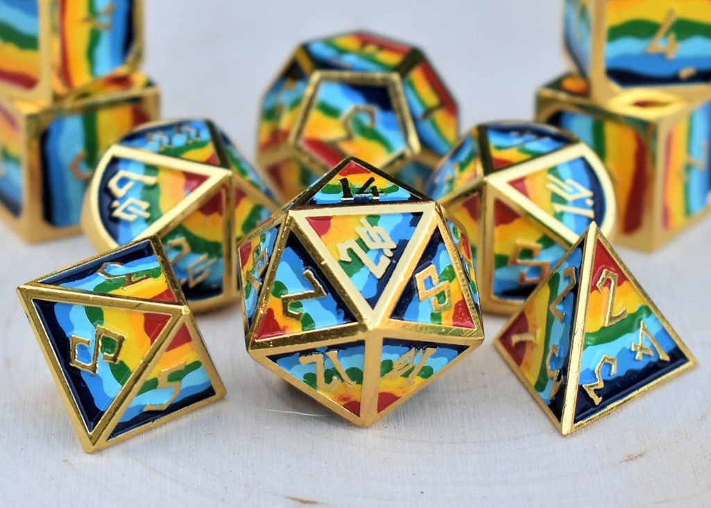 a set of rainbow metal dnd dice with gold borders and numbers on a wooden surface for wargaming tabletop gaming and board games