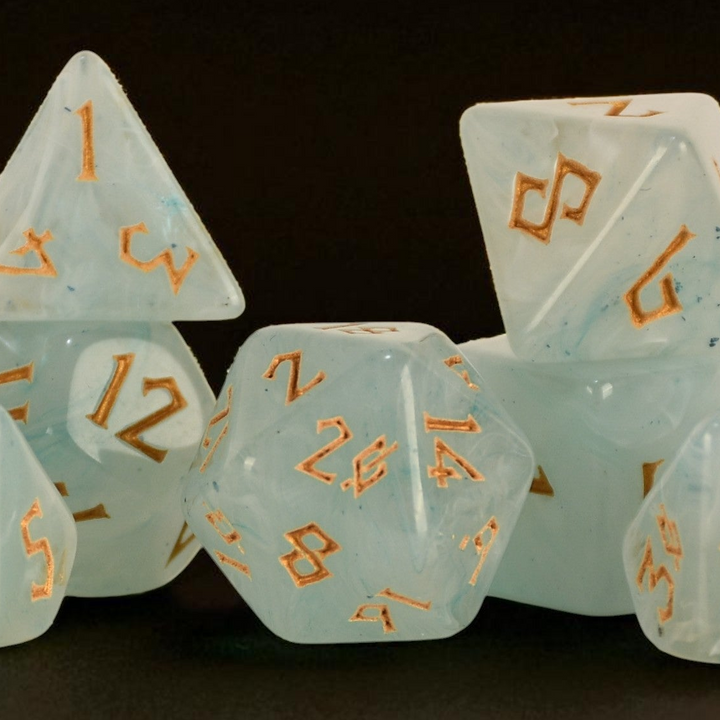 Set of light blue dice with orange numbers on a dark background