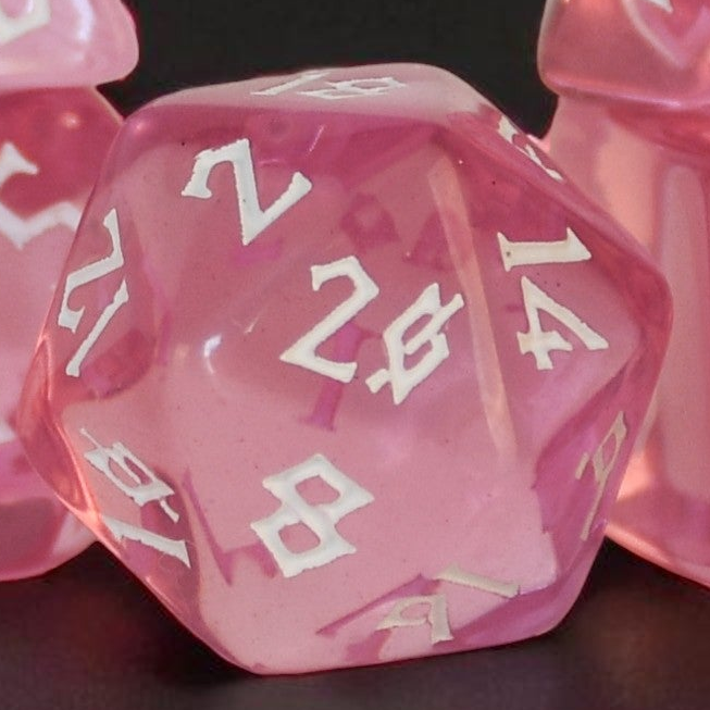 Pink clear acrylic dice set with white numbering in a nordic font for tabletop roleplaying games