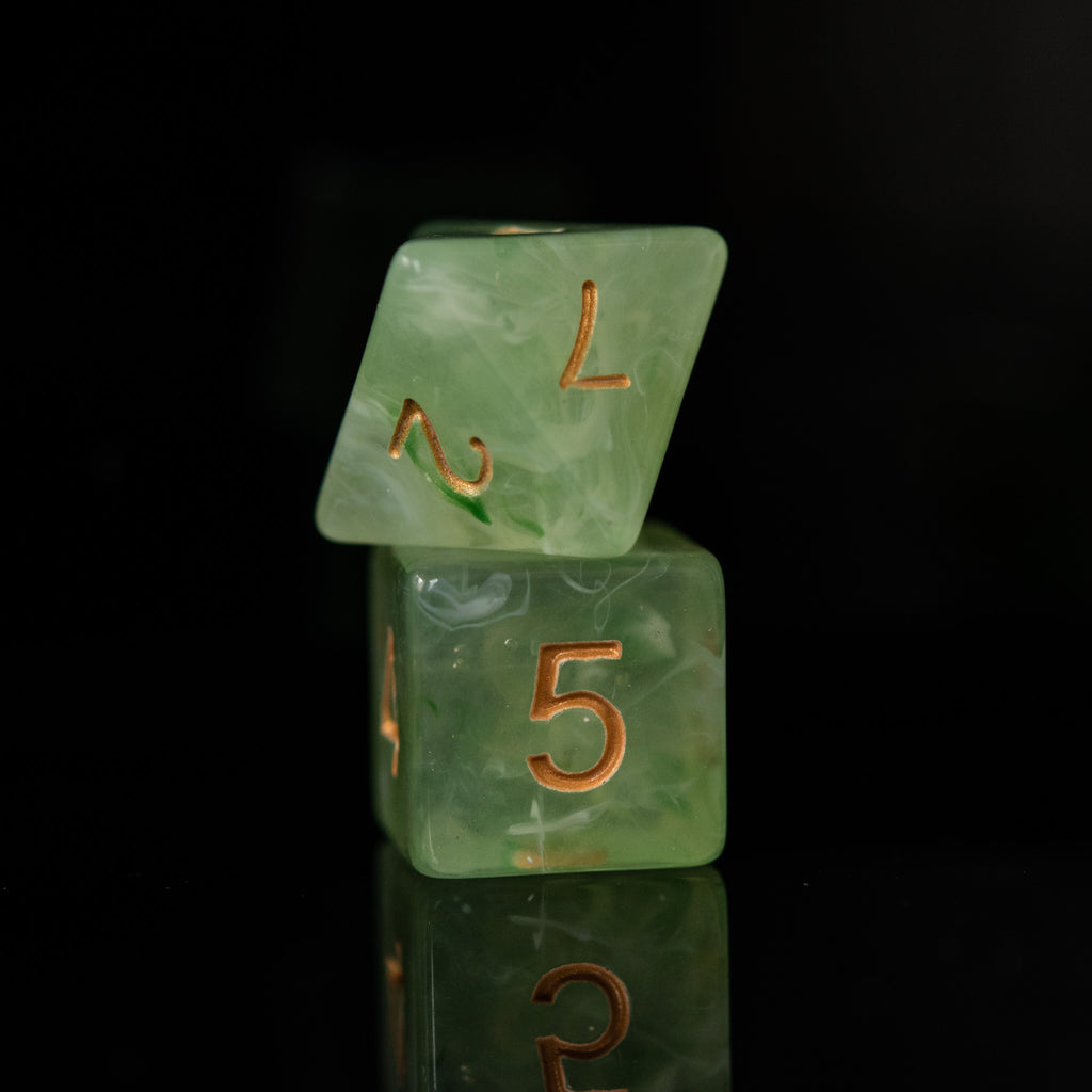 A d8 and a d6 in a green see through color with yellow numbers stacked for playing tabletop gaming 