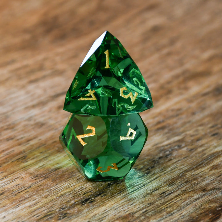 Emerald Multifaceted Glass Dice with gold numbering for dnd and ttrpg