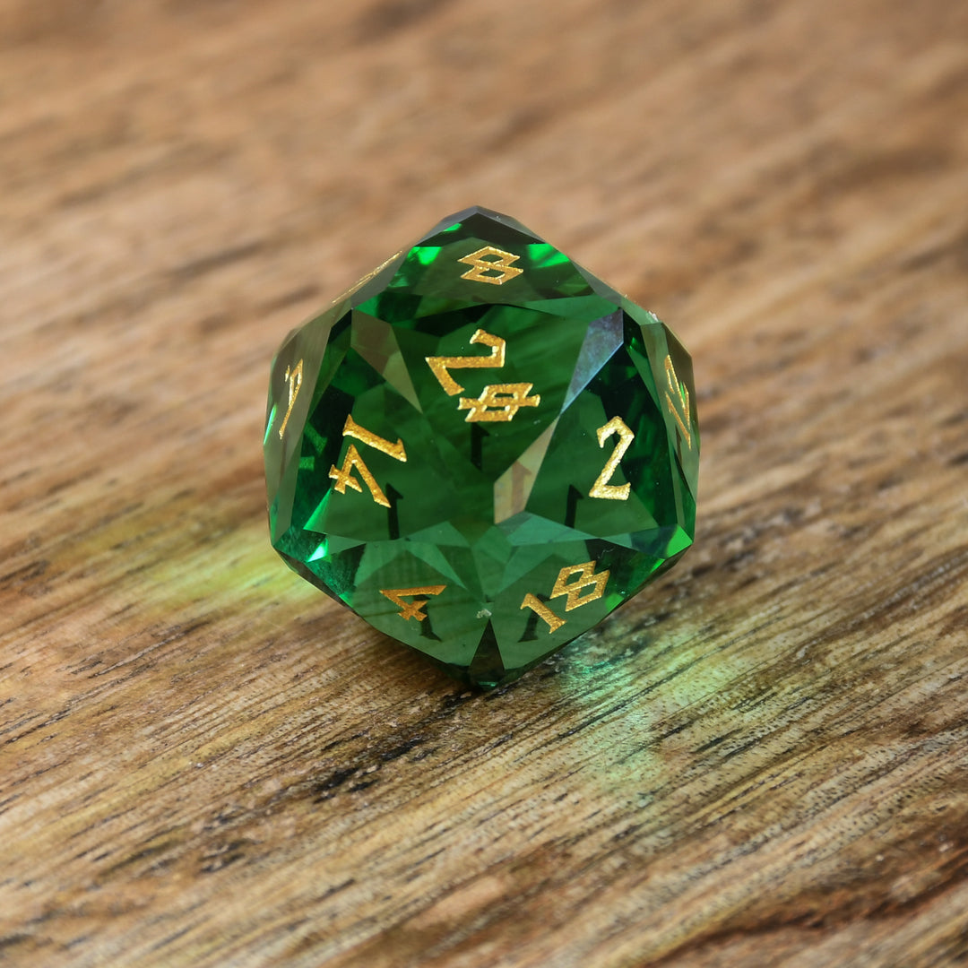 Emerald Multifaceted Glass D20 with gold numbering for dnd and ttrpg