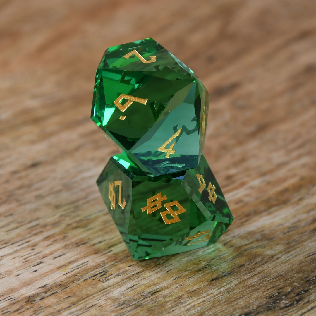 Emerald Multifaceted Glass Dice with gold numbering for dnd and ttrpg