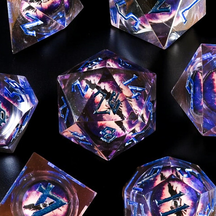 A set of resin liquid core dice with purple liquid and hand-painted numbers, including various shapes such as a four-sided die, six-sided die, eight-sided die, ten-sided die, twelve-sided die, and twenty-sided die.