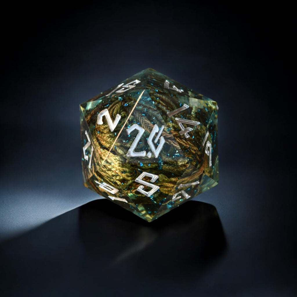 A hand-crafted clear resin dice with hand-painted numbers, shaped as a d20, with an enchanted lake appearance.