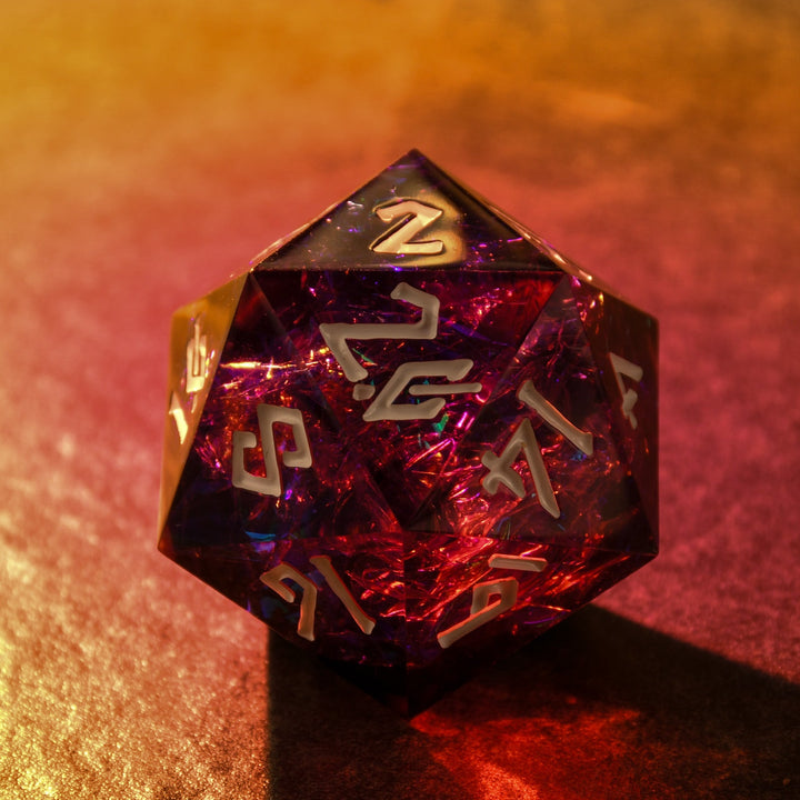 Multicolored d20 die with gold numbers on a dark background