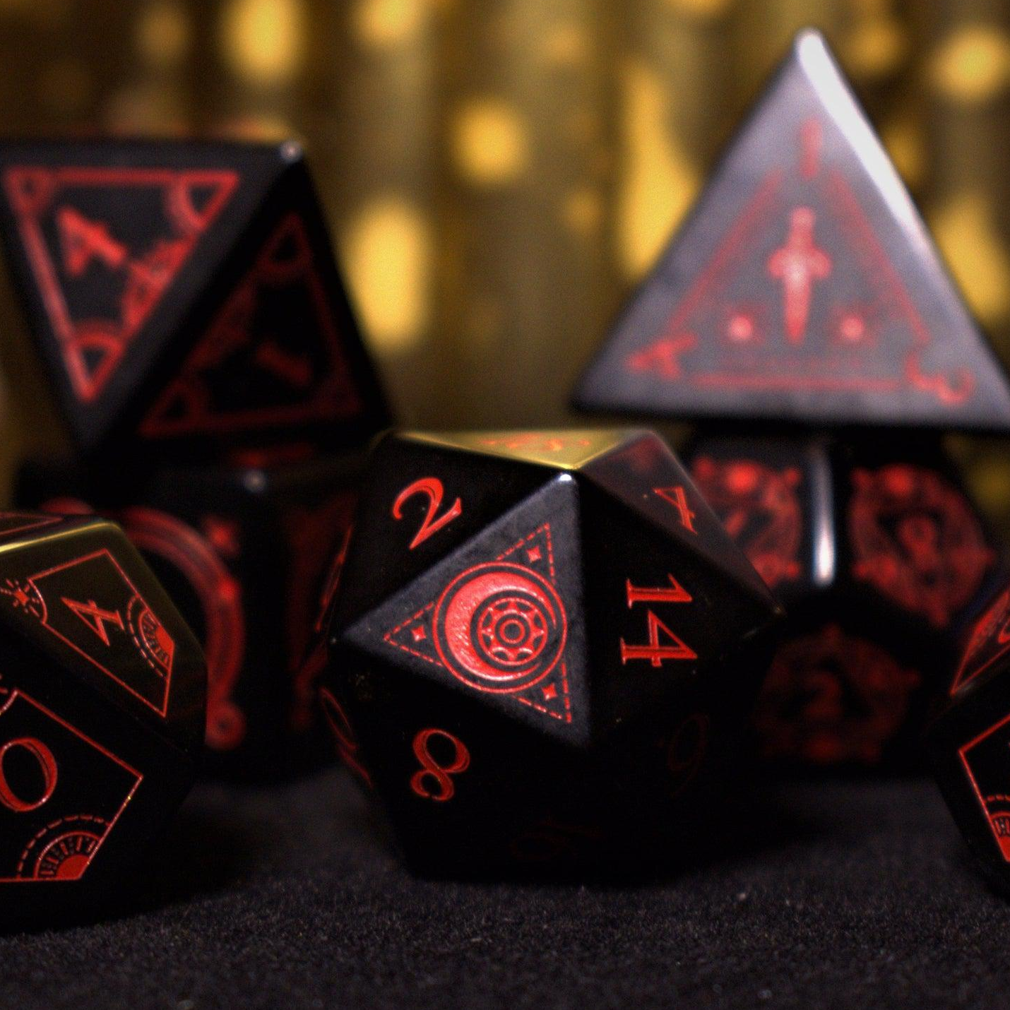 A set of black Obsidian gemstone dice with red engraved numbers and symbols, including a D4, D6, D8, two D10s, D12, and D20, displayed on a dark surface with a blurred light background.