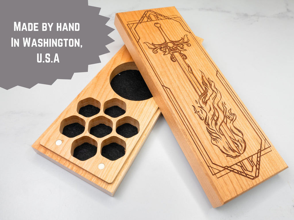 Wooden dnd dice vault with engraved design on a light gray background, featuring text 'Made by hand in Washington, U.S.A.'
