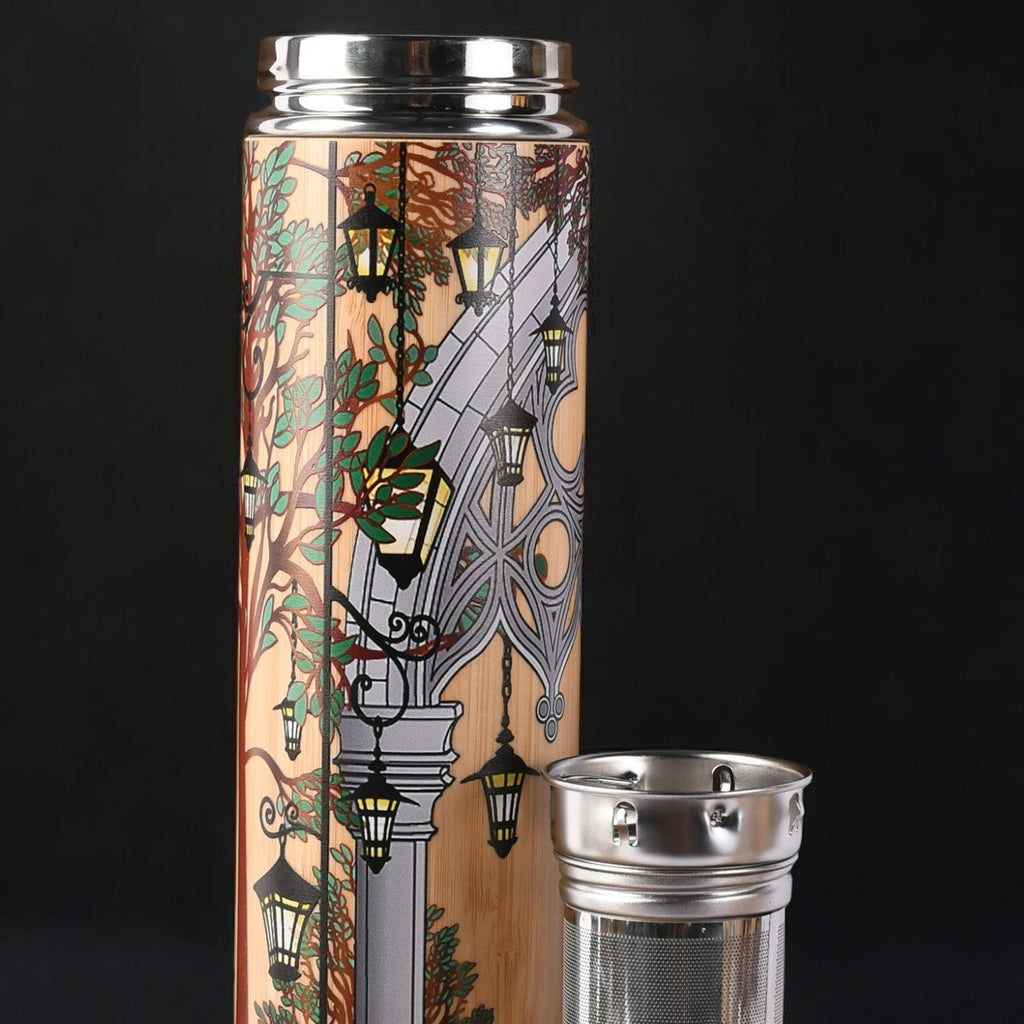 Tumbler with decorative design and metal lid and mesh tea infuser 