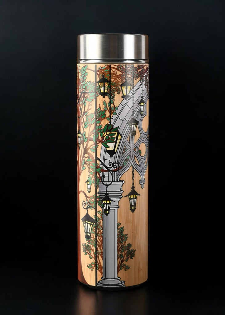 Tumbler with decorative design and metal lid and mesh tea infuser 