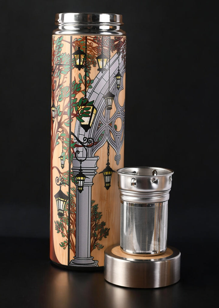 Tumbler with decorative design and metal lid and mesh tea infuser 