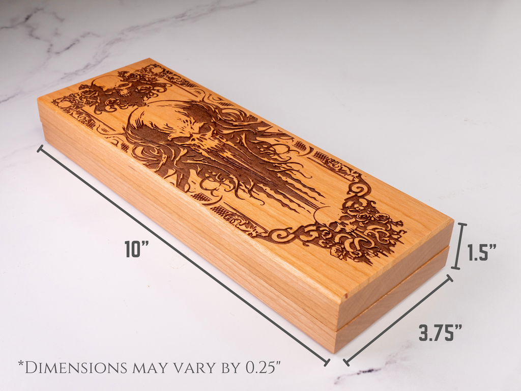 Wooden dice box with laser engraving on a white marble surface