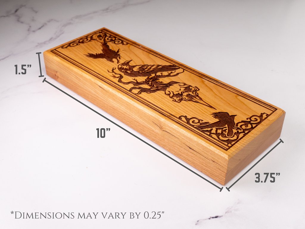 Wooden dice box with engraved design on a marble surface