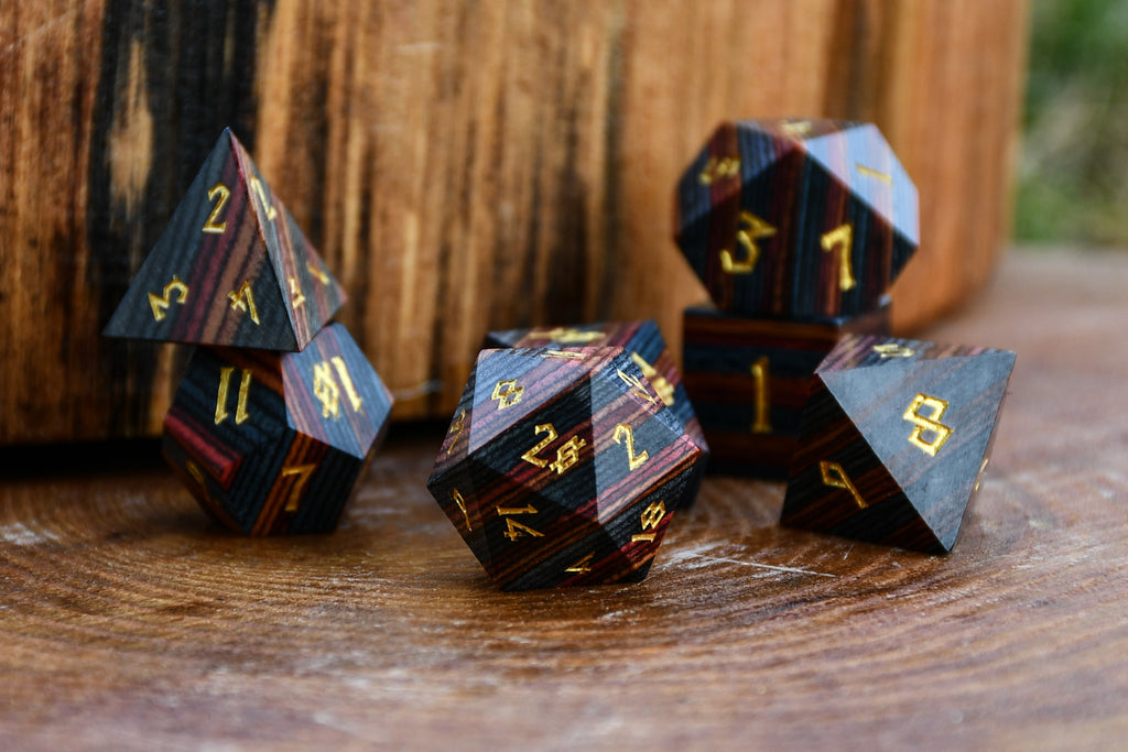 colorful striped polyhedral wood dice for dungeons and dragons